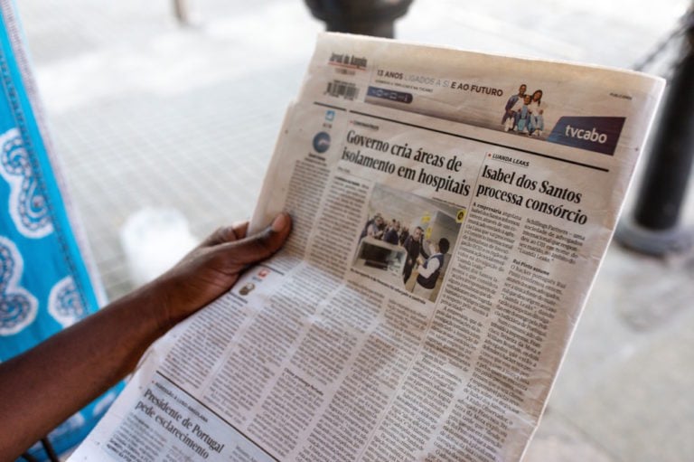 A man reads a story about corruption in a local newspaper, Luanda, Angola, 28 January 2020, Luke Dray/Getty Images