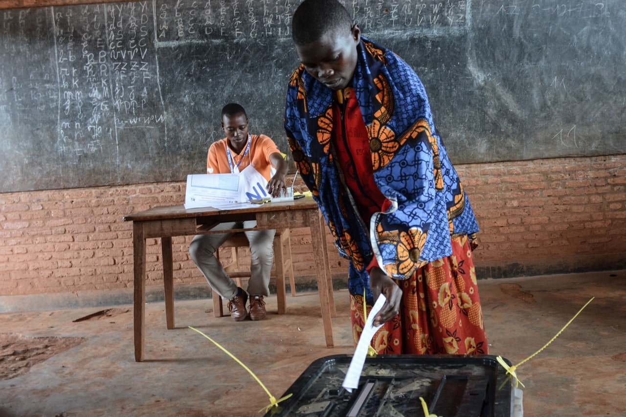 A woman casts her vote at a polling station in Ciri, northern Burundi, 17 May 2018 during the referendum on constitutional reforms, -/AFP/Getty Images