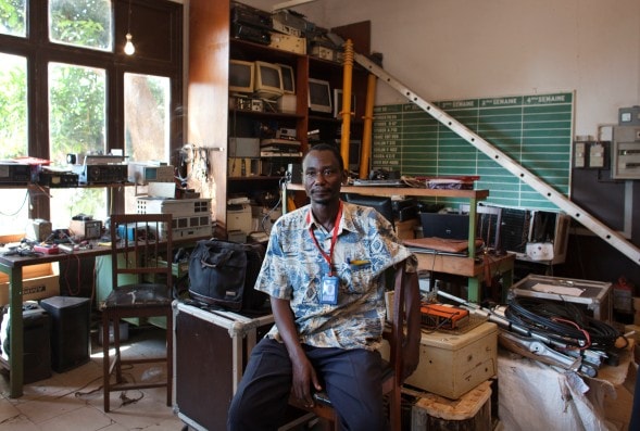 Yves Mbonzi Damanzi, a technician at the national radio station, poses for a picture in his office at the radio headquarters in Bangui, 28 November 2013. , REUTERS/Joe Penney
