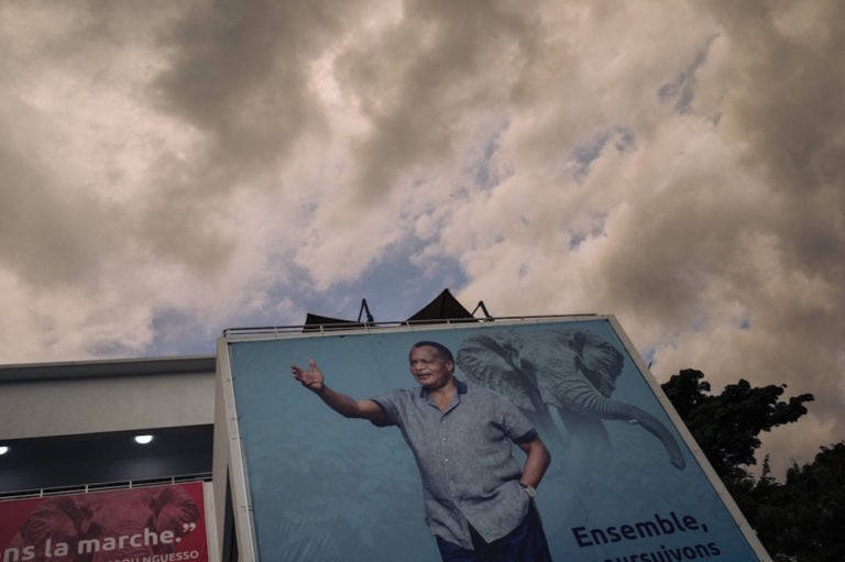 A campaign poster of Congo's re-elected President Denis Sassou Nguesso is pictured outside the headquarters of the ruling Congolese Labor Party (PCT) in Brazzaville, 23 March 2021, ALEXIS HUGUET/AFP via Getty Images