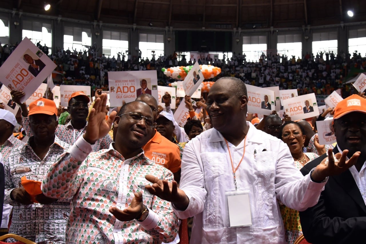 Then national assembly president Guillaume Soro (foreground L) and a state minister take part in a congress of the RDR party, in Abidjan, Cote d'Ivoire, 22 March 2015, SIA KAMBOU/AFP/Getty Images