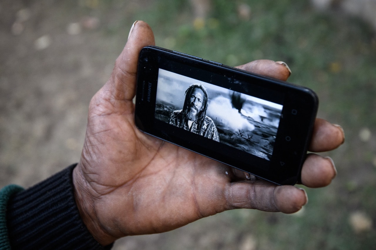 Teddy Dan, a Rastafarian artist and musician originally from Jamaica, shows a music video in which he is performing, in Shashamene, Ethopia, 26 January 2017 , Carl Court/Getty Images