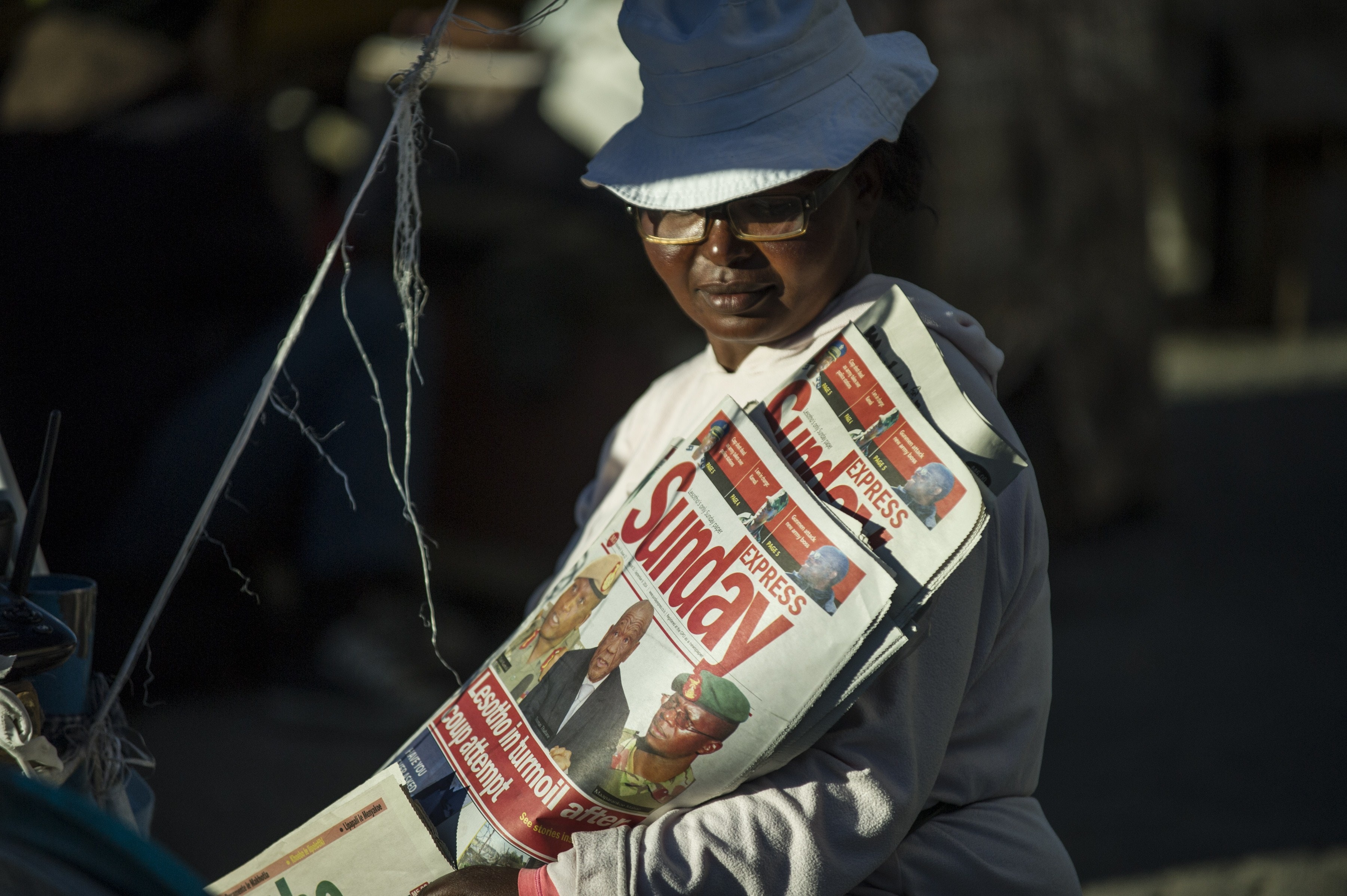 A newspaper seller is pictured on August 31, 2014 in Maseru, Lesotho, MUJAHID SAFODIEN/AFP/Getty Images