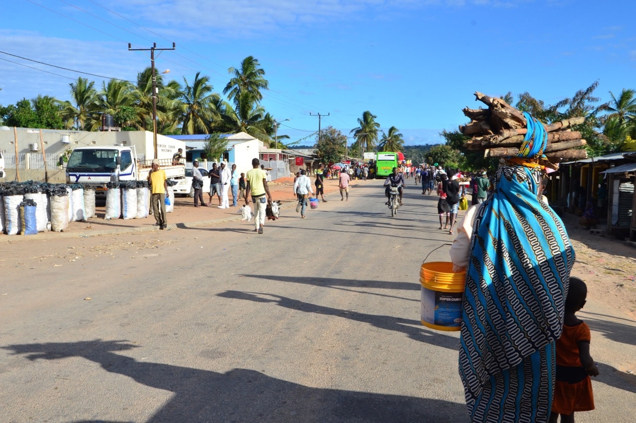 Residents walk through the streets of Macomia, in Cabo Delgado province, northern Mozambique, 11 June 2018, EMIDIO JOSINE/AFP/Getty Images