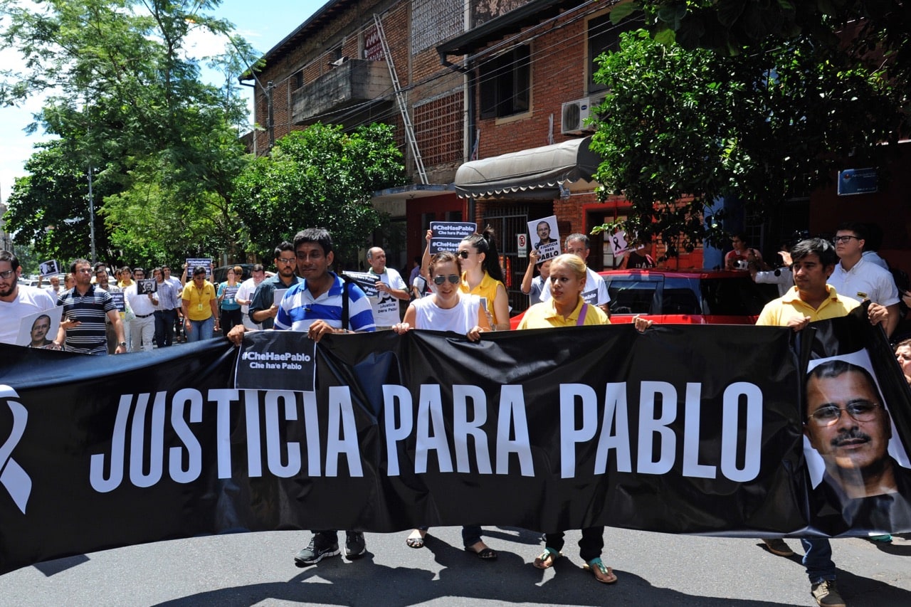Paraguayan journalists call for justice in the 2014 case of murdered journalist Pablo Medina, in Asuncion, 6 March 2015, NORBERTO DUARTE/AFP/Getty Images