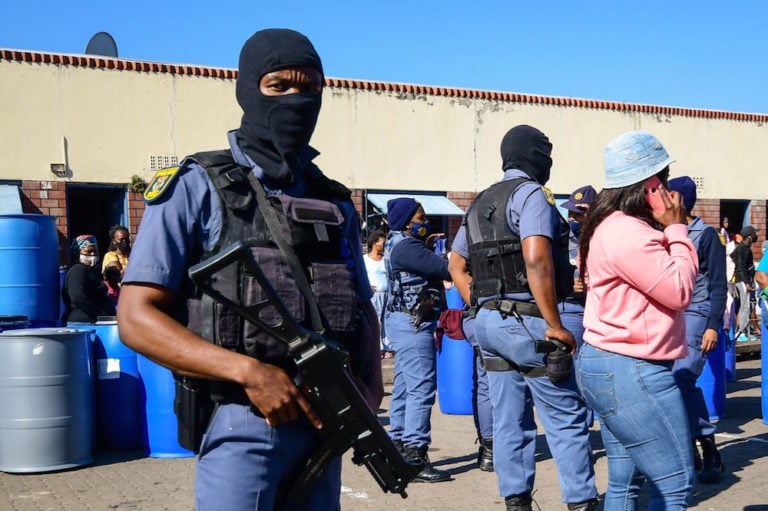 Police confiscate suspected looted goods at Mansel Market in Durban, South Africa, 19 July 2021, Darren Stewart/Gallo Images via Getty Images